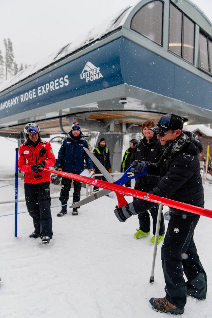 Kurt Castor, Jon Feiges, and Dave Hunter cut the opening ribbon for Mahogany Ridge Express chairlift.